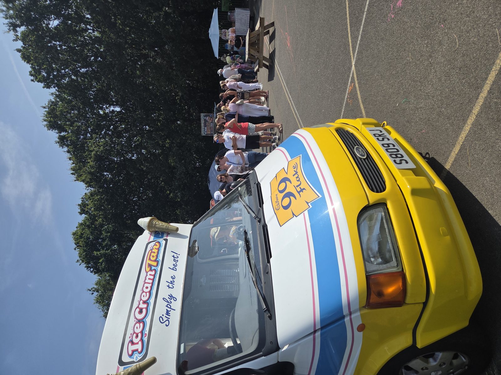 Guests queuing at the Ice T's ice cream van at an outdoor event in Cheshire